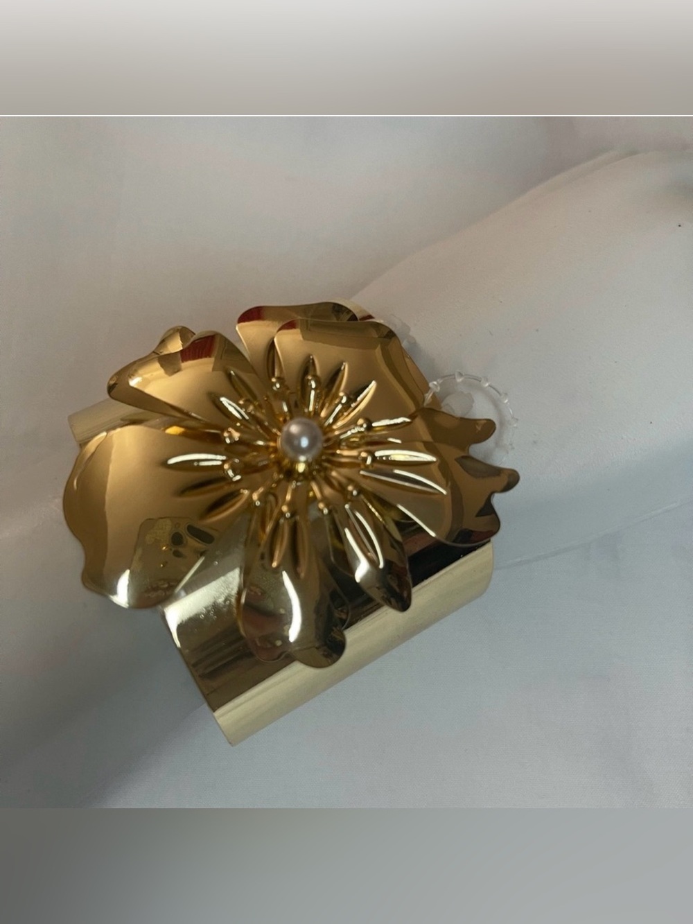 Gold tone metallic flower cuff bracelet